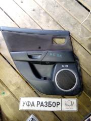 Запчасть обшивка двери задняя левая Mazda 3 2002-2009
