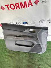Обшивка дверей передняя левая Mitsubishi Lancer 2004