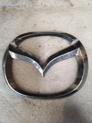 Запчасть эмблема передняя Mazda 6