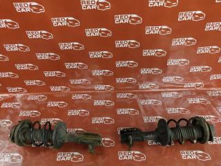 Запчасть стойка передняя левая MAZDA FAMILIA