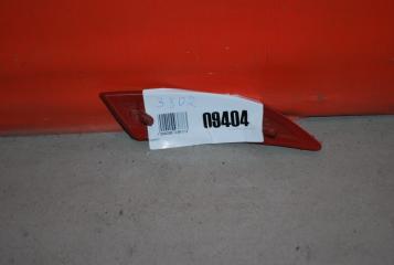 Отражатель в бампер задний левый Ford Focus