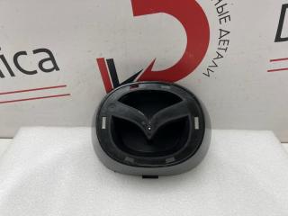Запчасть эмблема передняя Mazda CX-5 2017-2023