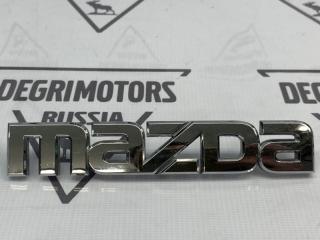 Фото запчасти эмблема Mazda 3 2012 контрактная запчасть Запчасть эмблема Mazda 3 2012