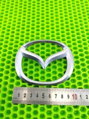 Эмблема задняя Mazda Demio 2002- 2007