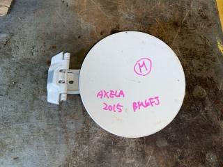 Фото запчасти лючок бензобака Mazda Mazda3 Б/У запчасть Запчасть лючок бензобака Mazda Mazda3