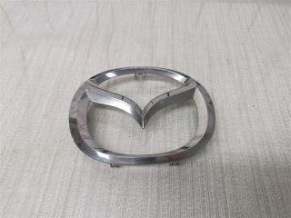 Запчасть эмблема передняя Mazda 3 2012
