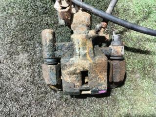 Запчасть суппорт задний левый MAZDA Familia