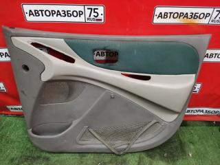 Обшивка двери передняя правая NISSAN TINO 1998